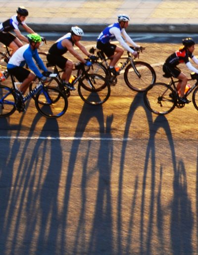 backlit cyclists