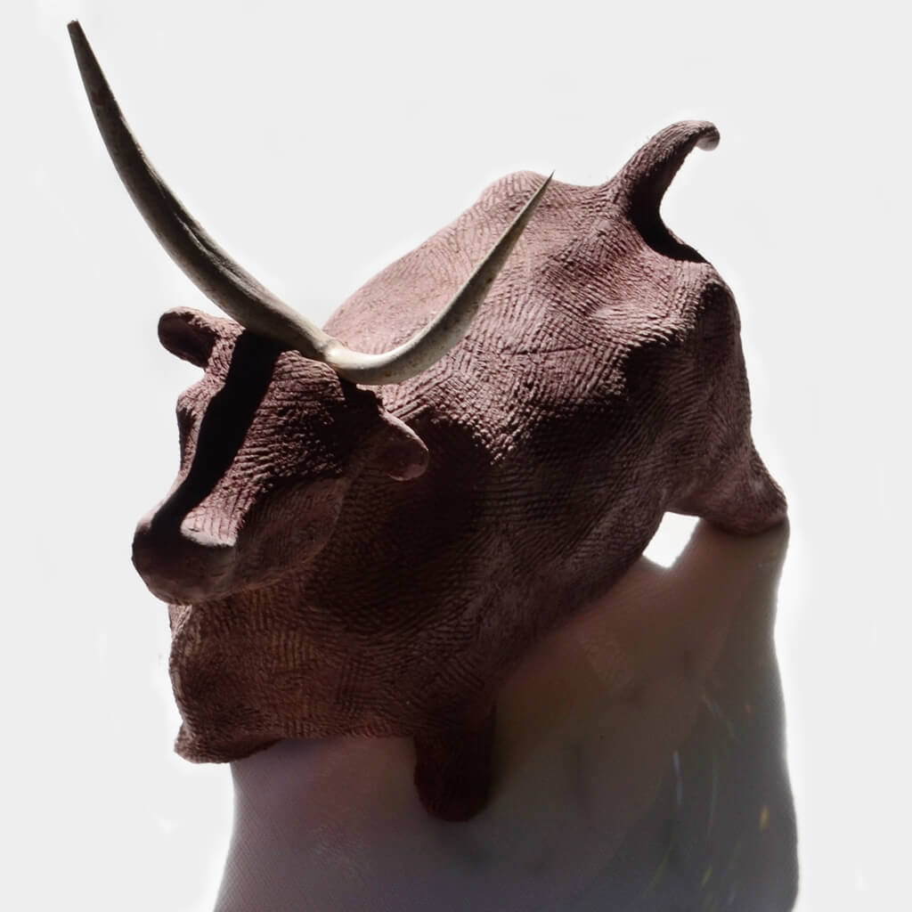 ceramic sculpture with thorns bull