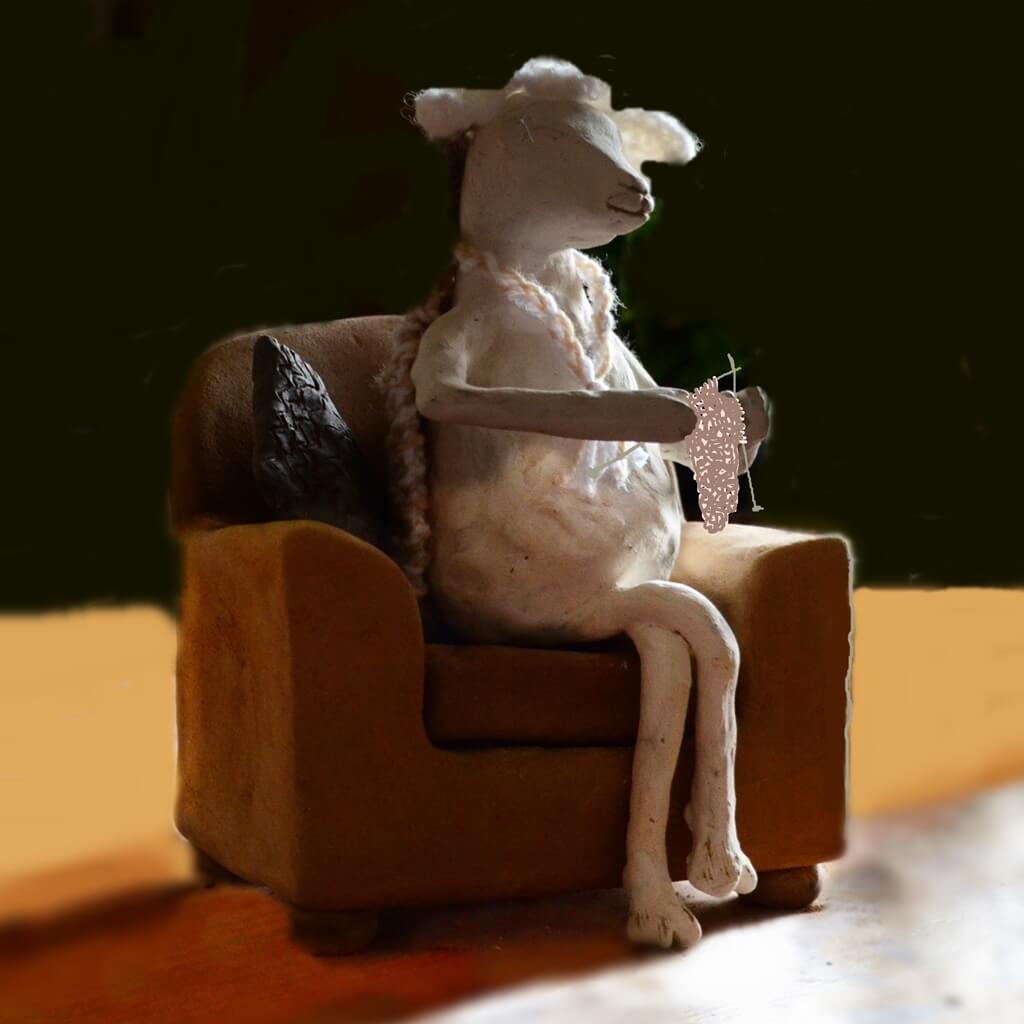 ceramic sculpture sheep knitting